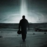 A shadowy man walks toward a bright flash of light in the distance.